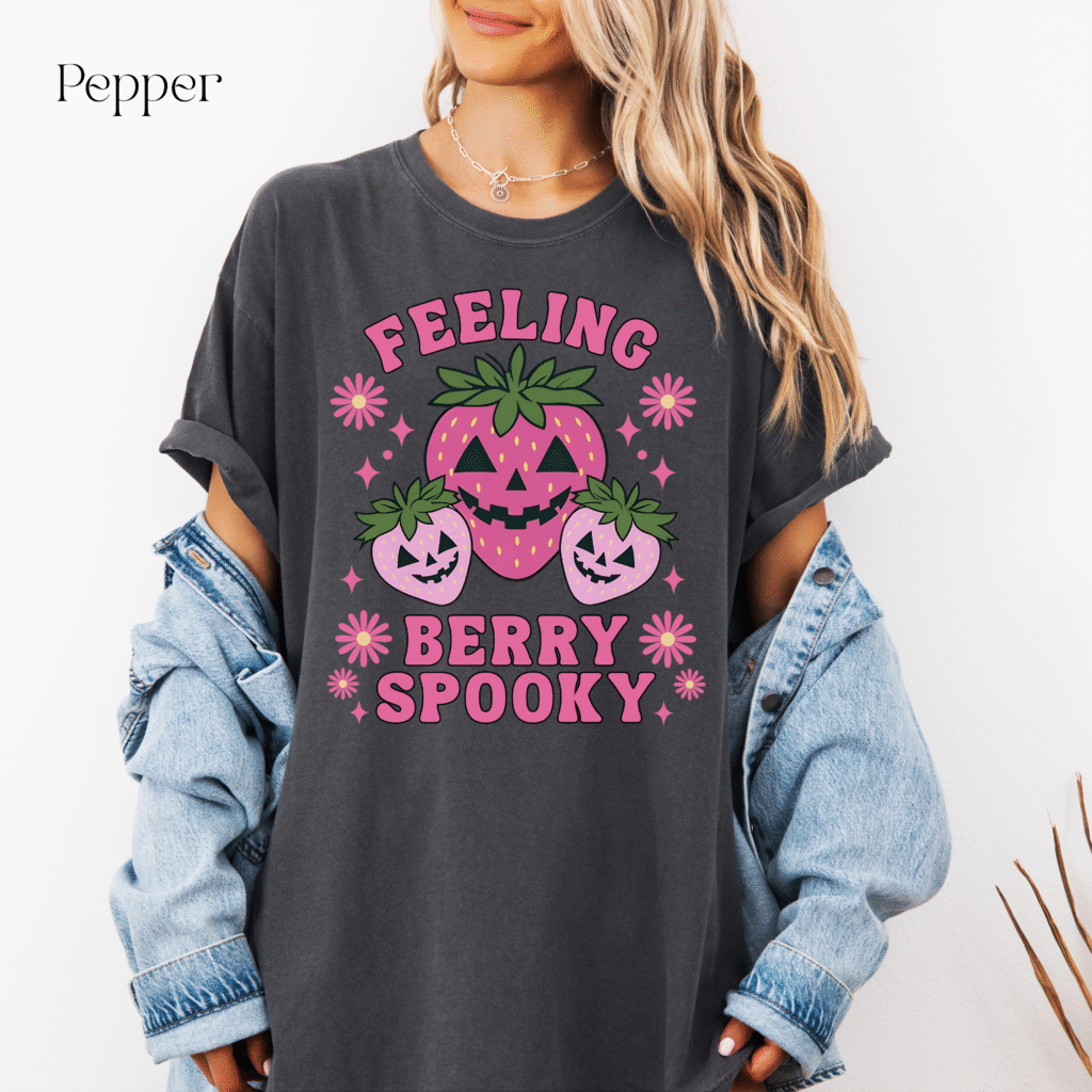 Feeling Berry Spooky Halloween shirt, cute fall graphic tee with strawberries, fun Halloween outfit idea.